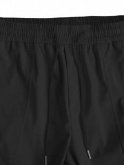 Muške široke cargo pantalone jednobojne sa pertlom u struku i džepovima