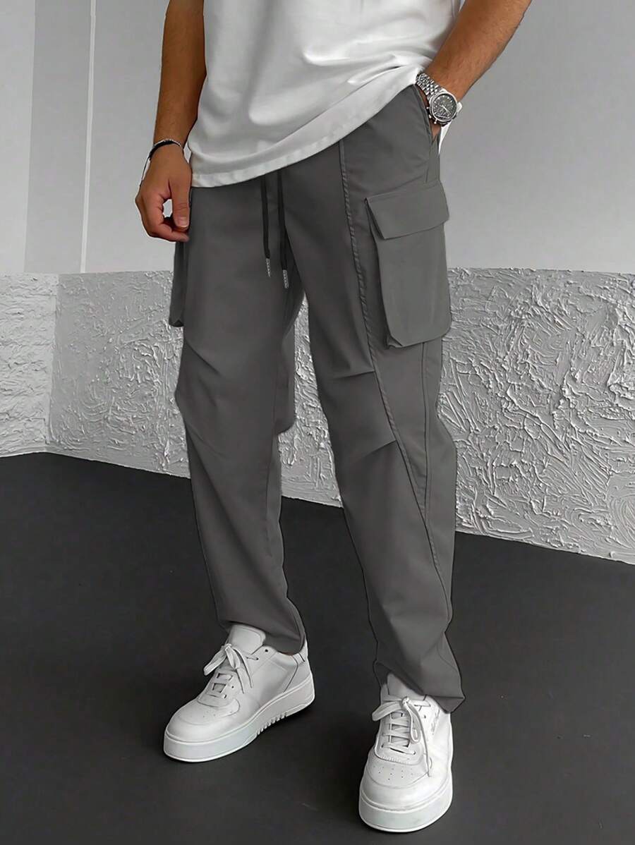 Muške široke cargo pantalone jednobojne sa pertlom u struku i džepovima