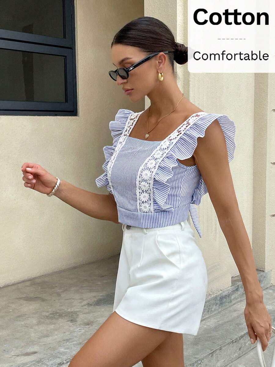Ženska elegantna crno‑bela bluzica sa čipkastim umetkom