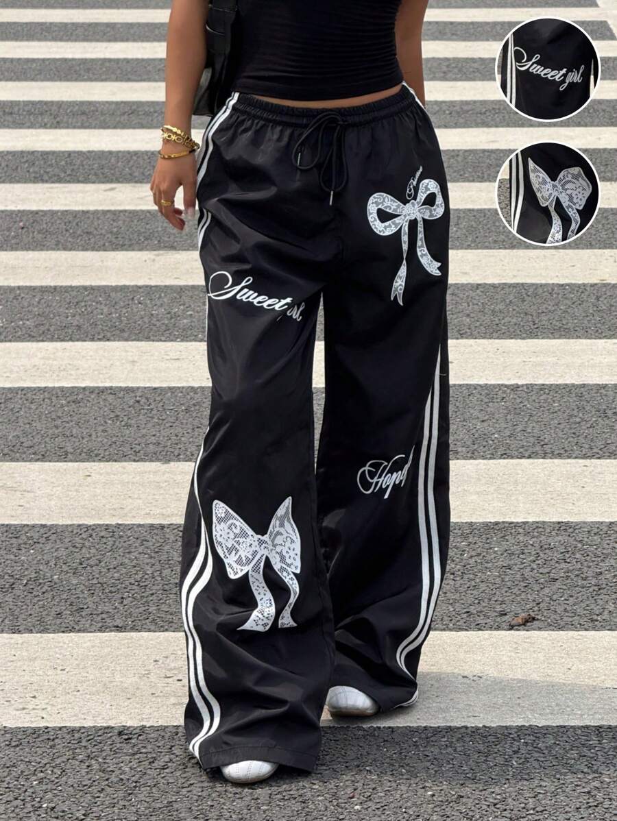Pantalone širokih nogavica sa roze printom mašne