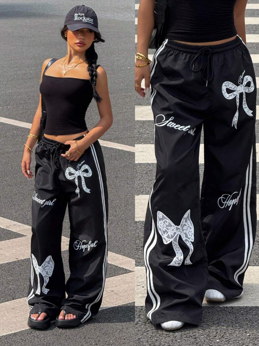 Pantalone širokih nogavica sa roze printom mašne