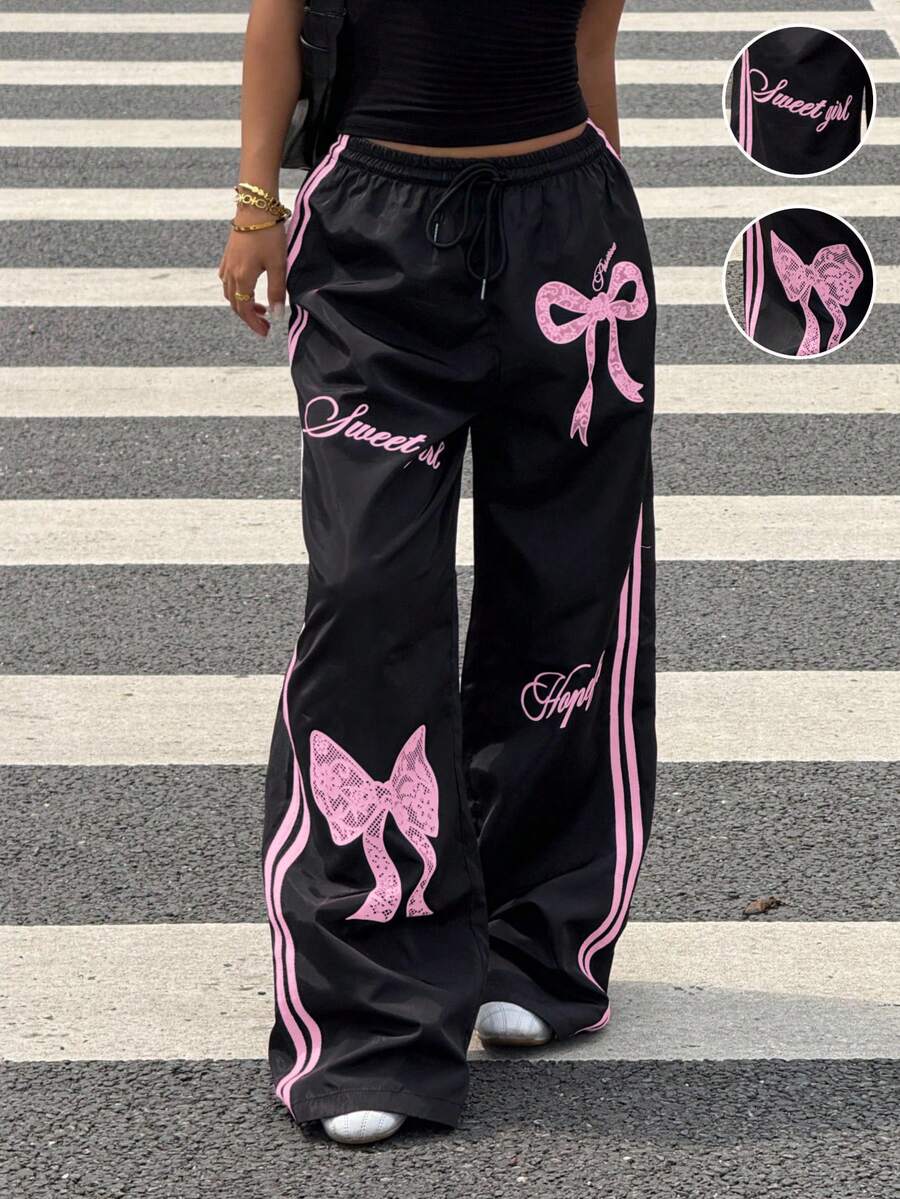Pantalone širokih nogavica sa roze printom mašne