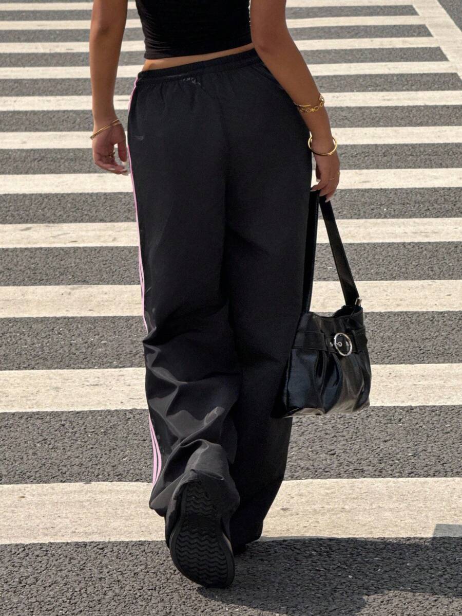 Pantalone širokih nogavica sa roze printom mašne