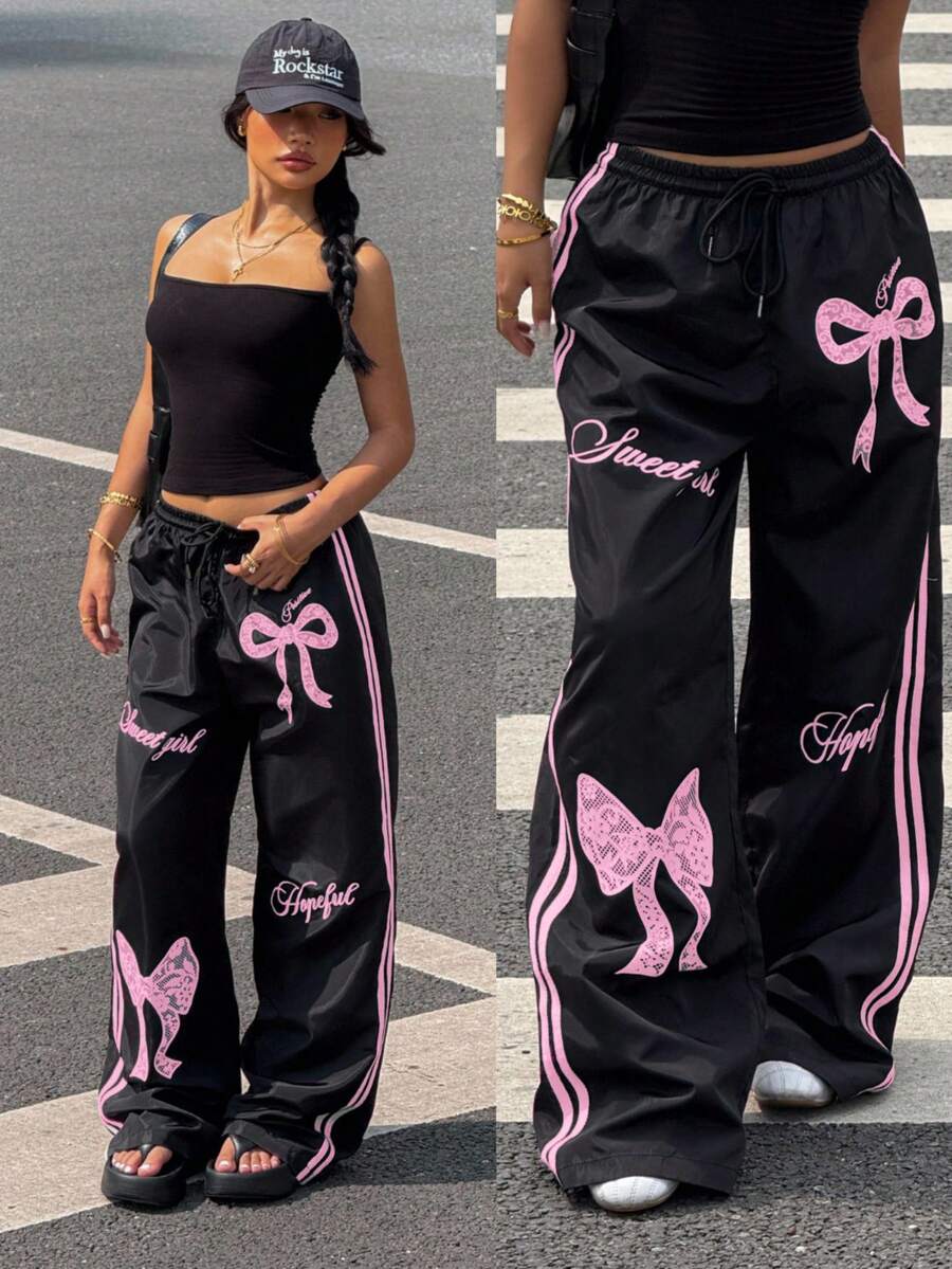 Pantalone širokih nogavica sa roze printom mašne