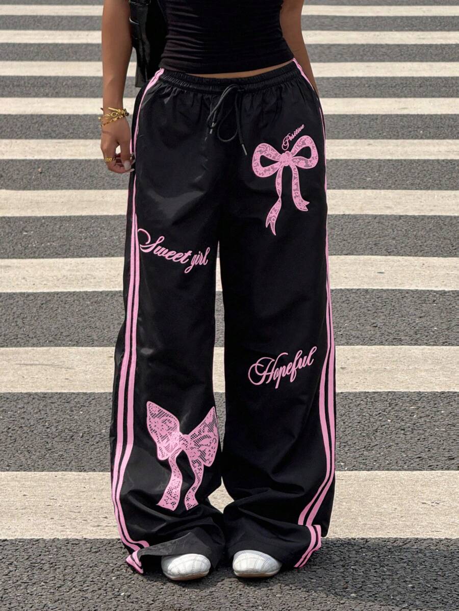 Pantalone širokih nogavica sa roze printom mašne