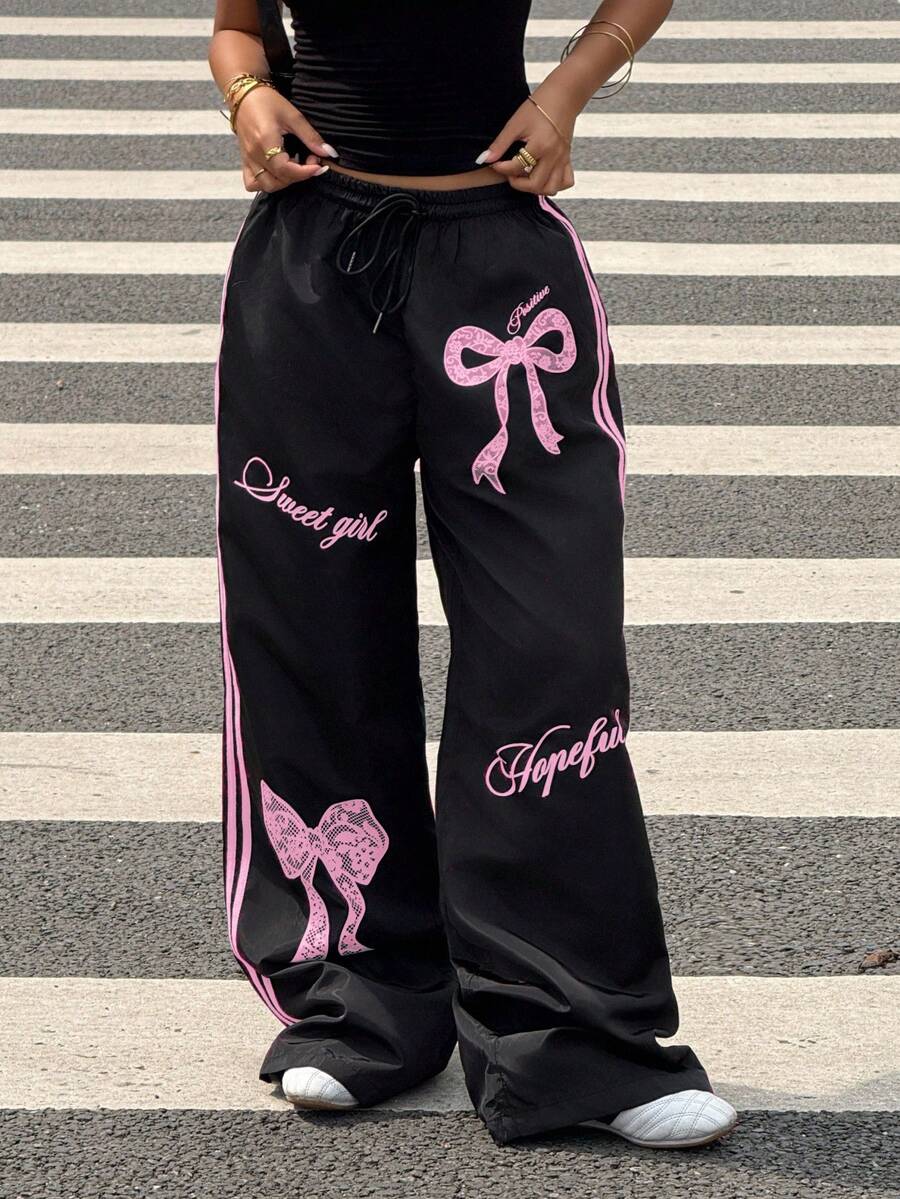 Pantalone širokih nogavica sa roze printom mašne