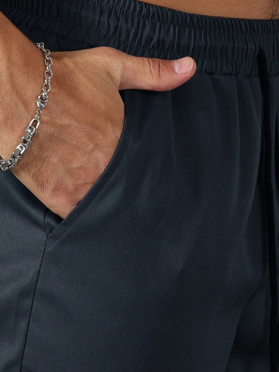 Muške ležerne pantalone ravnih nogavica jednobojne sa perticom u struku i džepovima
