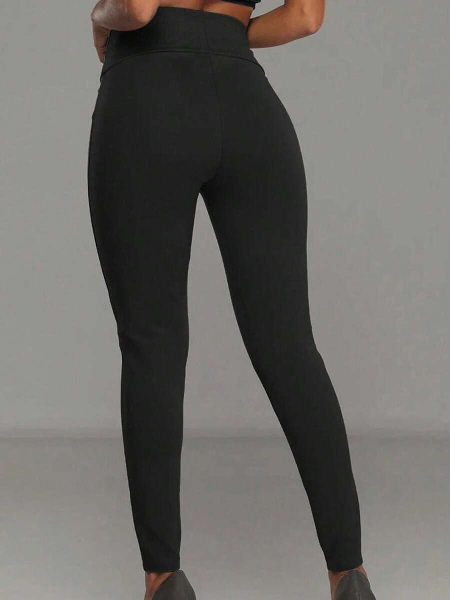 Ležerne uske pantalone sa visokim strukom i metalnom kopčom, jesenja tkanina za žene