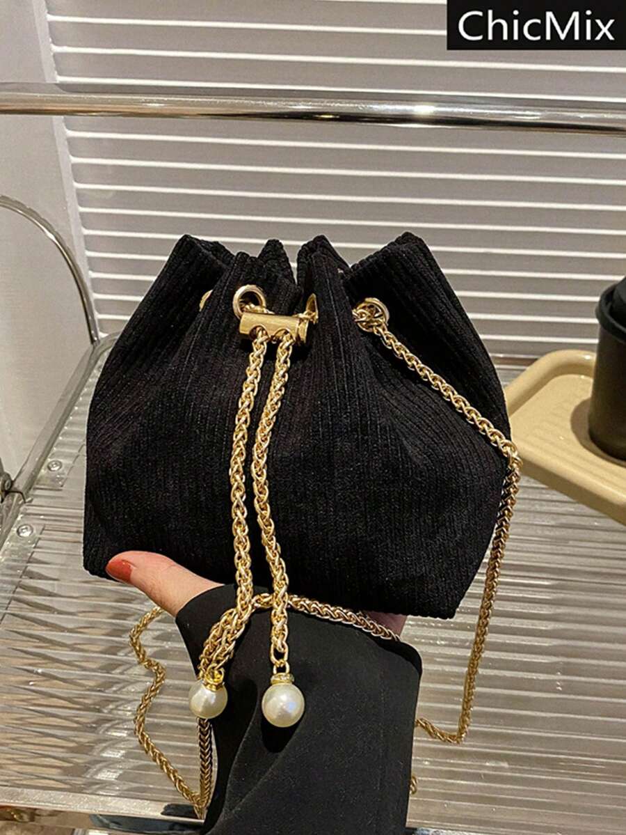 Moderna mini torba  jednobojna sa lanac kaišem
