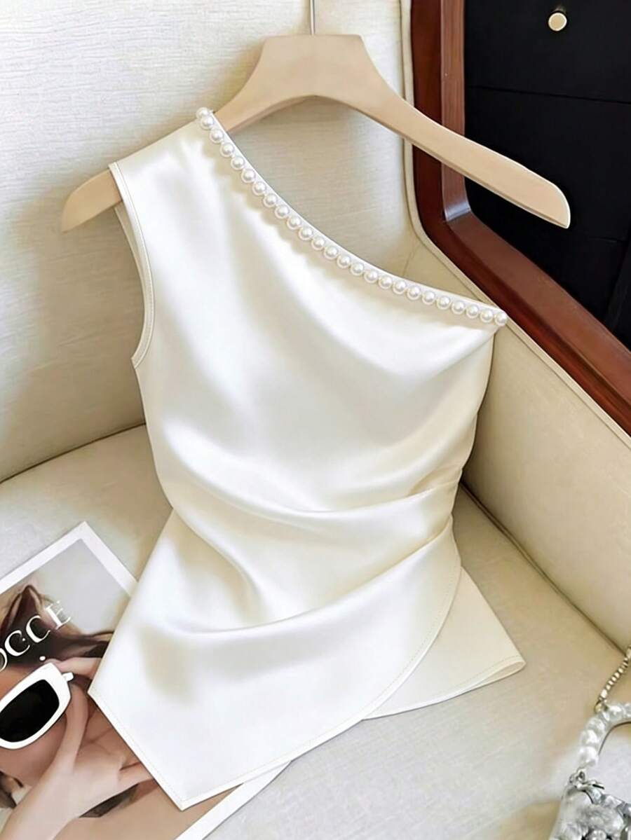 Franclia Ivory Satin Off White Asymmetric Shoulder Pearl Decor Twist Waist Asymmetrical Hem Sleeveless Top