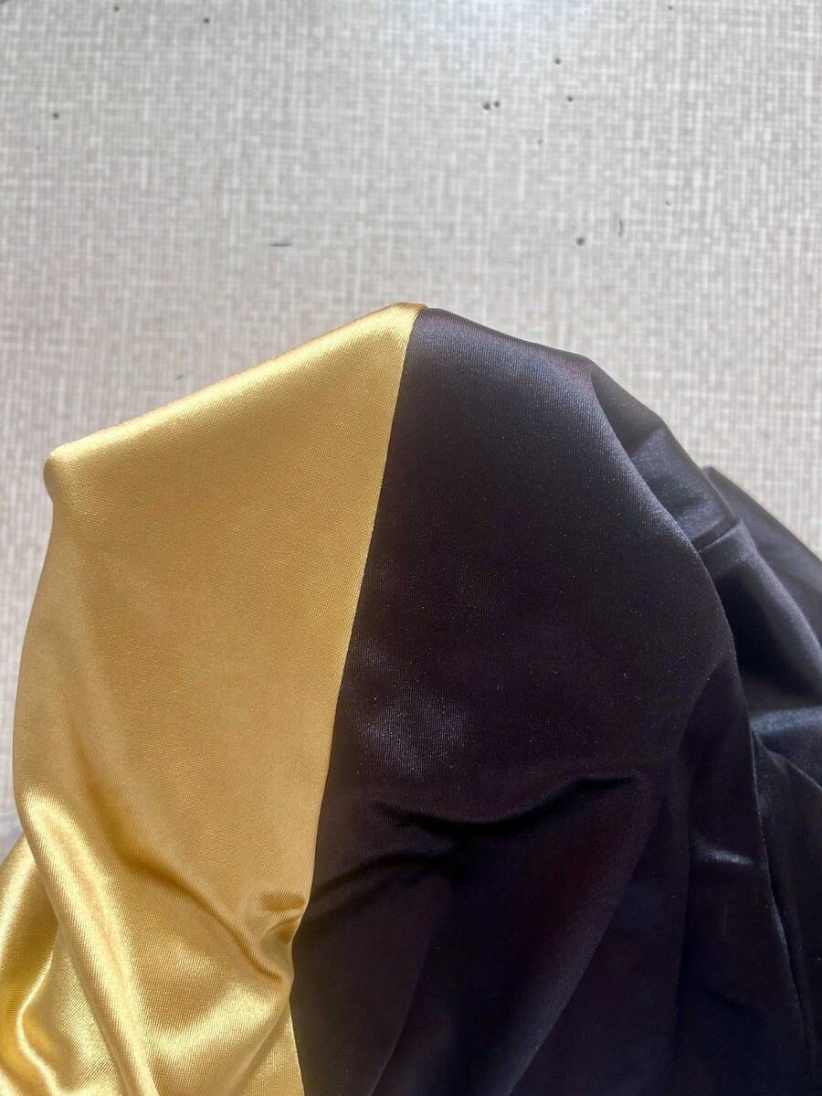 Ženska elegantna večernja haljina na jedno rame, crno-zlatna sa blok bojama