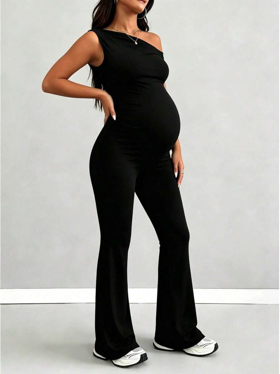 Dugi kombinezon bez rukava i otvorenih leđa, visoke elastičnosti, sa asimetričnim izrezom