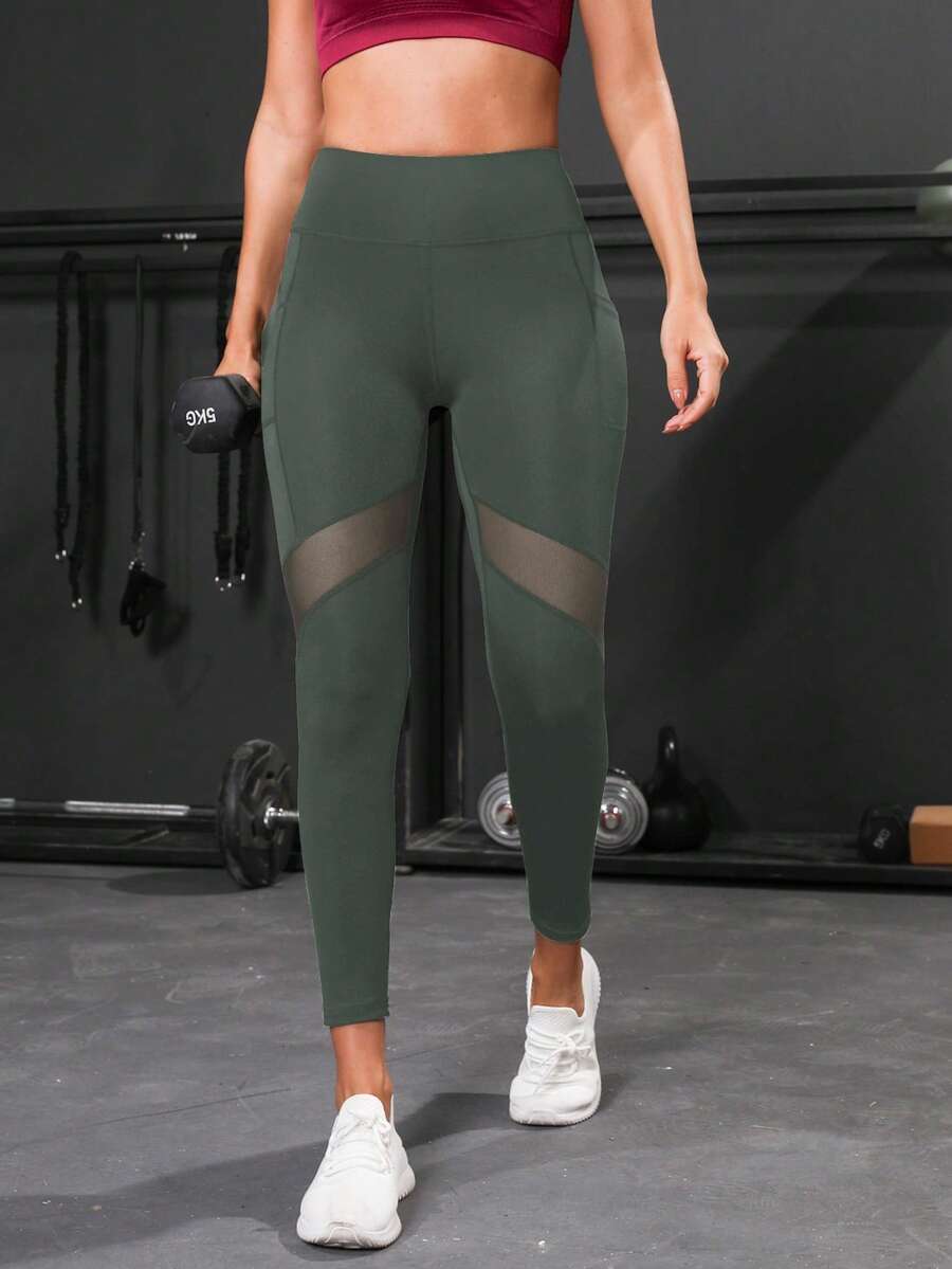Skraćene joga helanke sa kontrolom stomaka, kontrastnim mrežastim detaljima i bočnim džepom za telefon