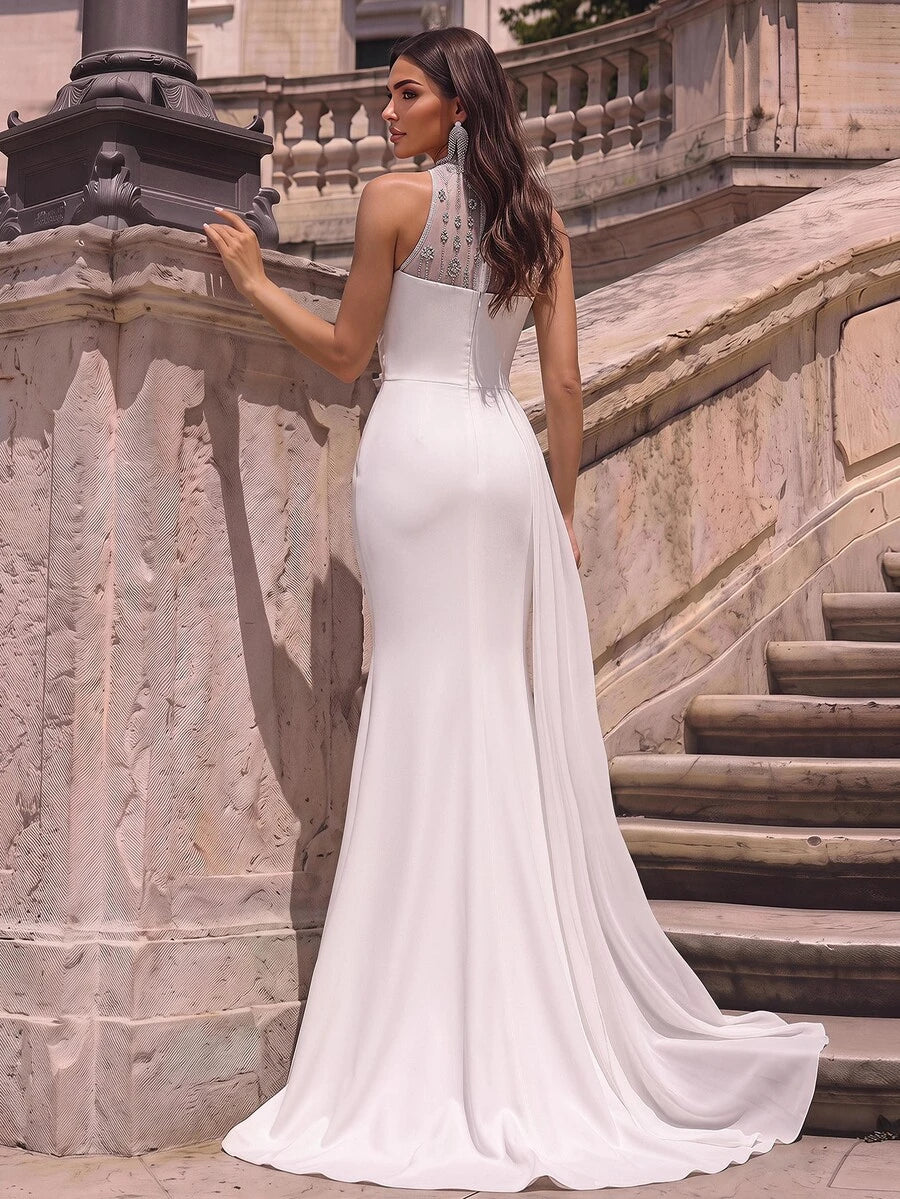 Elegantna romantična bela haljina od tkanine sa šljokicama i vezom