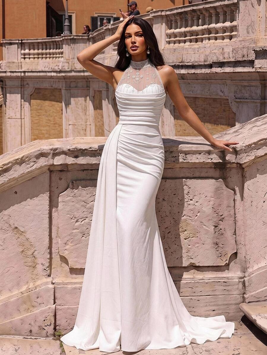 Elegantna romantična bela haljina od tkanine sa šljokicama i vezom